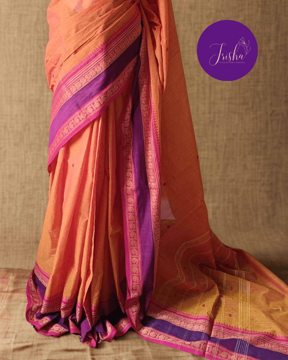 Pure Kanchi Cotton Saree in Yellow Shade With Pink Border, it has Buttas on Saree and Thread Border with traditional Peacock and Mango Motifs.