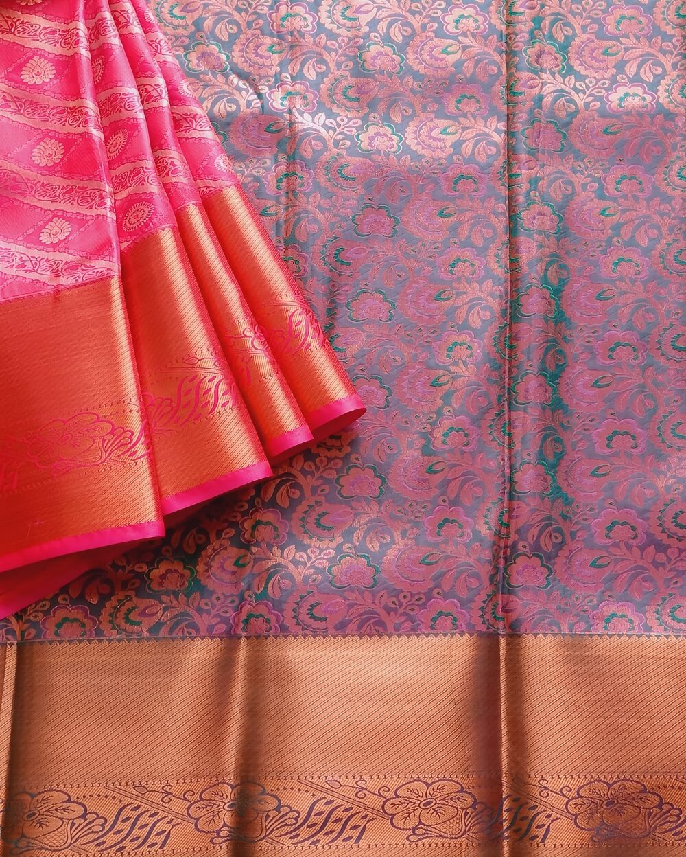 Kanchipuram / Kanjivaram Silk Saree, A bright pink shade with gold zari work all over the saree, a gold zari self border with contrast Green Pink Pallu. This saree comes with a Green Pink dual tone colour Blouse piece attached.