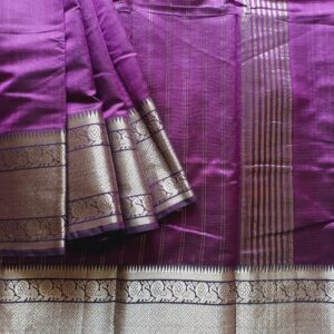 Mangalgiri Silk Cotton saree woven in Pure mulberry silk with cotton. Rich purple shade with Silver Zari border. Border is woven in Kanchipuram Peacock motifs.