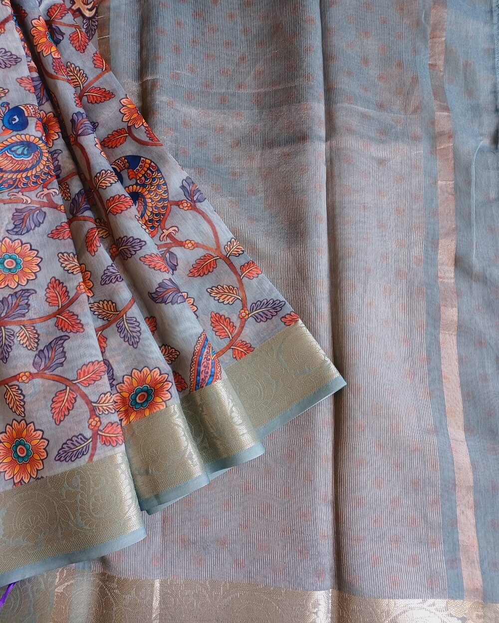 Chanderi Saree silk cotton in Light Teal blue shade with Tissue pallu . Saree has been printed with kalamkari prints, Blouse piece has small floral prints.