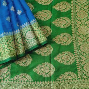 Georgette Saree in Light Blue with Light Green combination, Khaddi Border with Light Gold zari weaves in the Banarasi floral buttis work all over the saree.