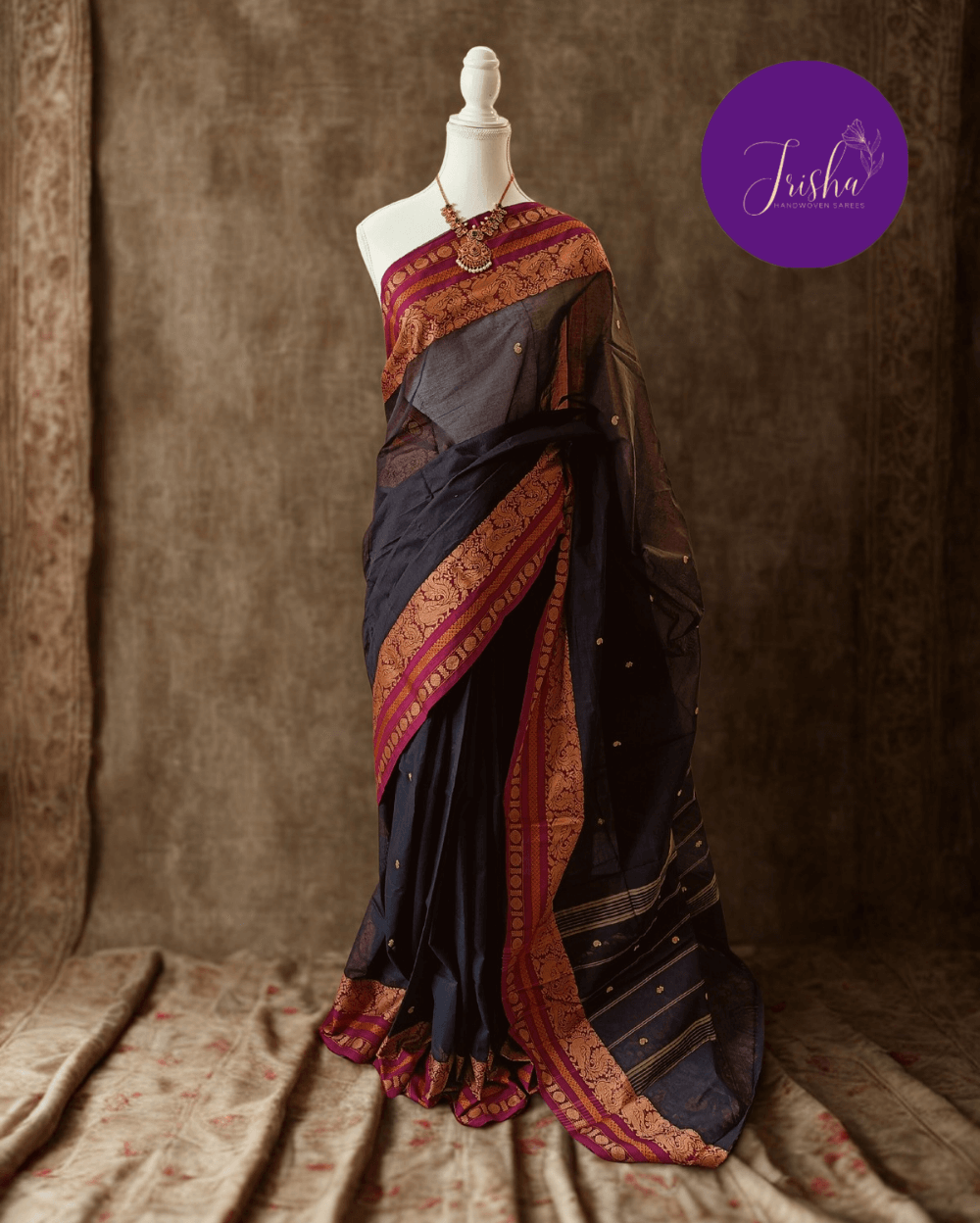 Chettinad Cotton Saree in Black with Pink border, It has Buttas on saree with Thread woven border in Peacock and Rudraksham motifs and Simple Pallu with stripes.