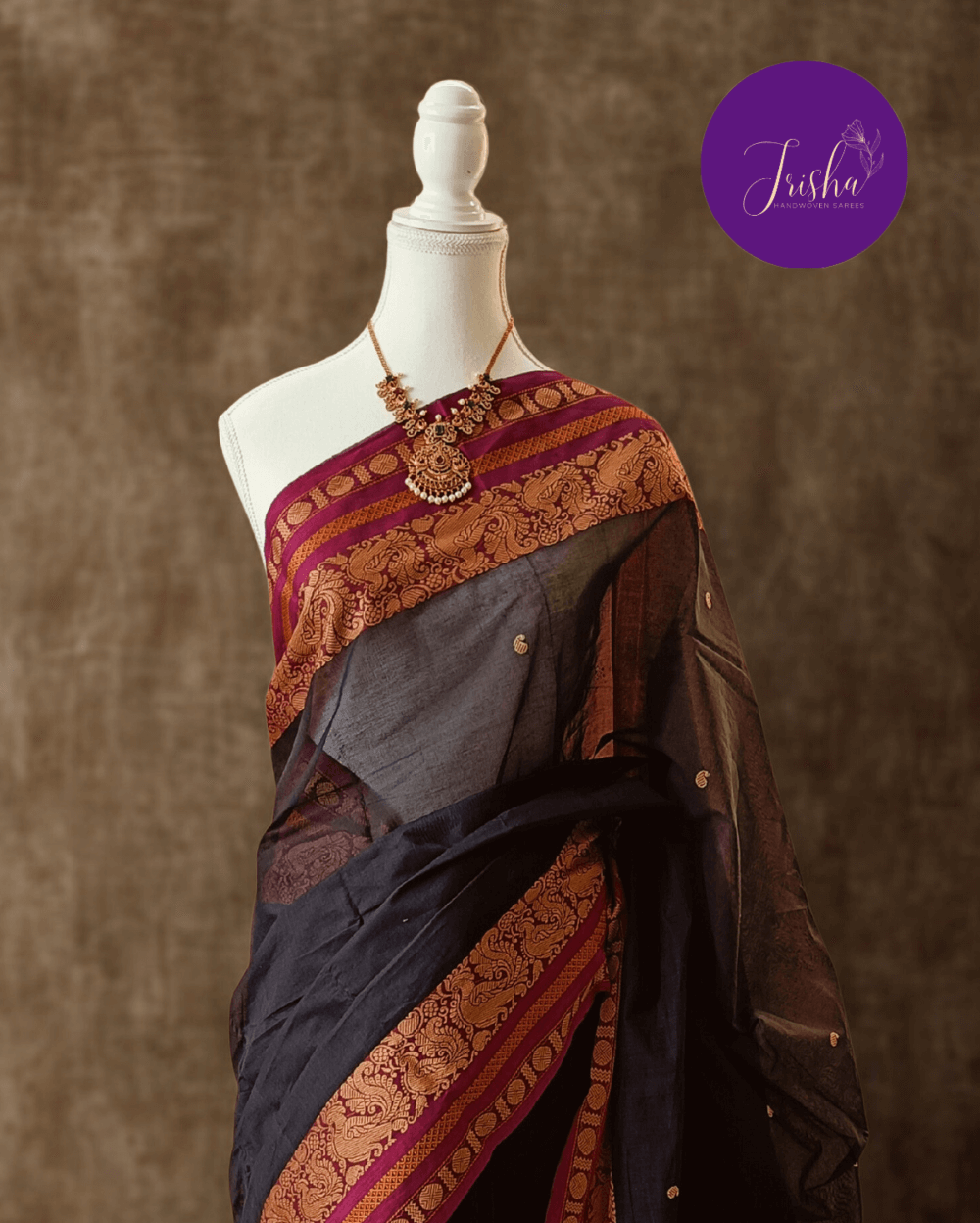 Chettinad Cotton Saree in Black with Pink border, It has Buttas on saree with Thread woven border in Peacock and Rudraksham motifs and Simple Pallu with stripes.