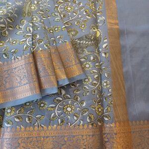 Banarasi Silk with Gold zari work and Kalamkari digital prints all over. Classic Grey with self border in Gold zari. Grey blouse piece with small floral prints.
