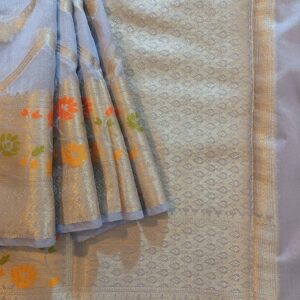 Georgette Saree in Greyish Blue Shade with Silver zari weaves in the famous Banarasi Jaal work. Border- has Banarasi floral motifs with Meena work,