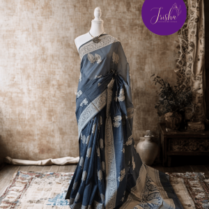 Banarasi Cotton Saree in Grey Shade with Cream resham threads woven all over. It has traditional Banarasi floral and kali (bud) motifs. It has a very unique pallu with beautiful traditional Banarasi floral motifs. A very unique collection in cotton woven with a very rare traditional pattern.