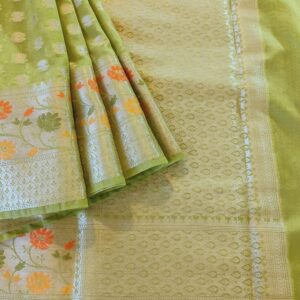 Georgette Saree in Mehandi Green Shade with Silver zari weaves in Butta work. Border has Banarasi floral motifs with Meena work. Pallu have Silver zari work.