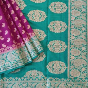 Georgette Saree in Rich Purple with Rama Green combination, Khaddi Border with Light Gold zari weaves in the Banarasi floral buttis work all over the saree.