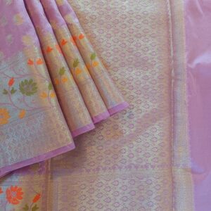 Georgette Saree in Purple shade with Silver zari weaves in Butta work. Border has Banarasi floral motifs with Meena work, Pallu have silver zari work.