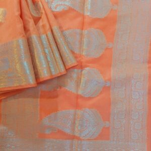 Georgette Saree in Peach shade with Silver zari weaves in the traditional leaf motifs. Border has Banarasi floral motifs. Pallu has Rich silver zari work.
