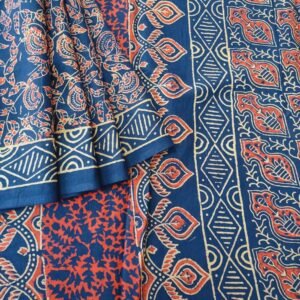 Pure Mulmul Cotton Saree in Dark Blue Shade. This soft cotton saree has been completely hand block printed with Bagru prints in floral motifs with natural dyes.