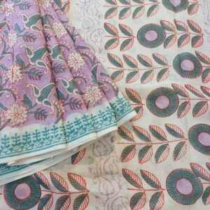 Pure Mulmul Cotton Saree in Light Lilac. This soft cotton saree has been completely hand block printed with Bagru prints in floral motifs with natural dyes.