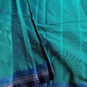 Handloom Pure Kanchi Cotton Saree, in Peacock Blue shade with Black small border, it is Butta Saree with Thread Border . Its Border has small motifs woven with a contemporary look. Perfect for formal or office wear and minimal work cotton saree lovers