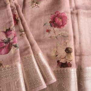 Tussar silk saree in Onion Pink shade with floral digital prints, it has a very elegant silver border with small motifs. A very contemporary earthy shade with subtle shine and classic prints. Saree comes with a blouse piece in small prints.
