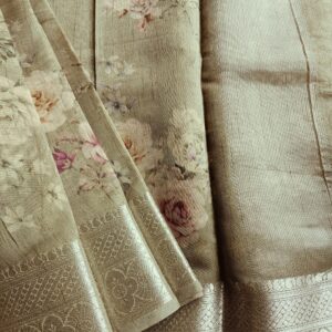 Tussar silk saree in Sage Green shade with floral digital prints, it has a very elegant silver border with small motifs. A very contemporary earthy shade with subtle shine and classic prints. Saree comes with a blouse piece in small prints.