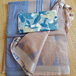 Light chocolate brown linen saree with silver tissue zari border and contrast handcrafted - hand block printed mul mul cotton blouse piece, The Linen saree comes with small thread woven geometric motifs all over the saree in blue shade with a subtle silver tissue zari border. The pallu is simple with blue stripes. The blouse piece is running blouse piece that comes along with saree and the additional one is a beautiful hand block printed.
