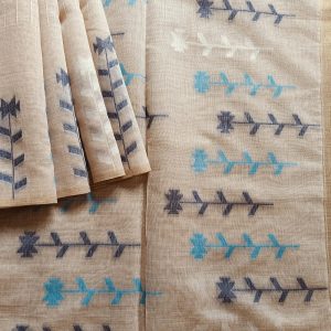 Chanderi Saree silk cotton in Light Beige with blue Jamdani motifs woven all over. Saree comes with a blouse piece in small buttis. Blouse is in contrast shade that matches with the buttis and borders, Pallu has beautiful floral weaves in jamdani pattern.