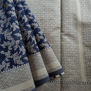 Banarasi Cotton Saree in Dark Blue colour with Cream resham threads woven all over. It has traditional Banarasi floral motifs in jaal weaves which is a very famous traditional weave where the motifs are interconnected throughout the saree.