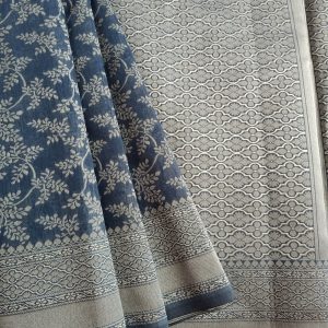 Banarasi Cotton Saree in Grey colour with Cream resham threads woven all over. It has traditional Banarasi floral motifs in jaal weaves which is a very famous traditional weave where the motifs are interconnected throughout the saree.