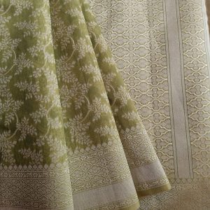Banarasi Cotton Saree in Light Green colour with Cream resham threads woven all over. It has traditional Banarasi floral motifs in jaal weaves which is a very famous traditional weave where the motifs are interconnected throughout the saree.