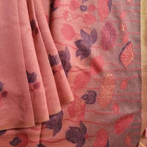 Chanderi Saree silk cotton in Peach Pink shade with lotus motifs woven all over. Pallu has beautiful floral weaves in Pichwai pattern. Borderless sarees for a contemporary look. Beautiful and rich pallu. Saree comes with a blouse piece in small buttis. Blouse is in same shade that matches the shade of saree.