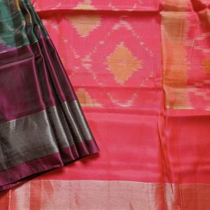 Mulberry silk mix saree woven in ikkat handloom weaves. This Ikkat silk saree has Tissue zari borders with classic colour combinations Bottle Green shade with rich wine and silver border. It has a lovely bright Pink Pallu and plain blouse piece that matches pallu.