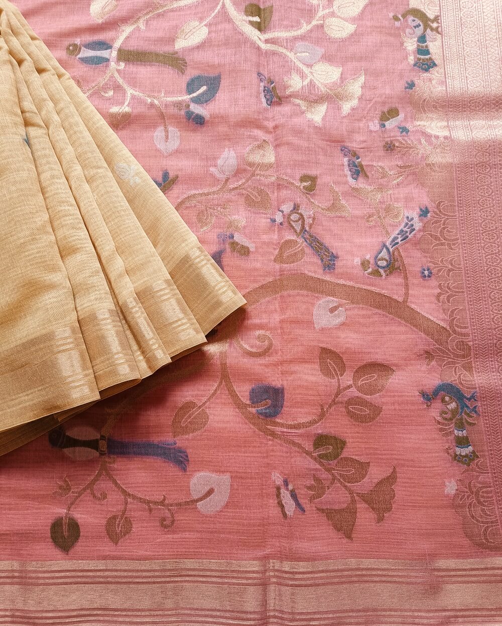 Chanderi Saree silk cotton in Light yellow shade with small Butta motifs woven all over. Pallu is in a contrast light pink shade and has beautiful weaves in Pichwai pattern. Small Tissue Border saree for an elegant look. Beautiful and rich pallu. Saree comes with a blouse piece in small buttis. Blouse is in same shade that matches the shade of pallu.
