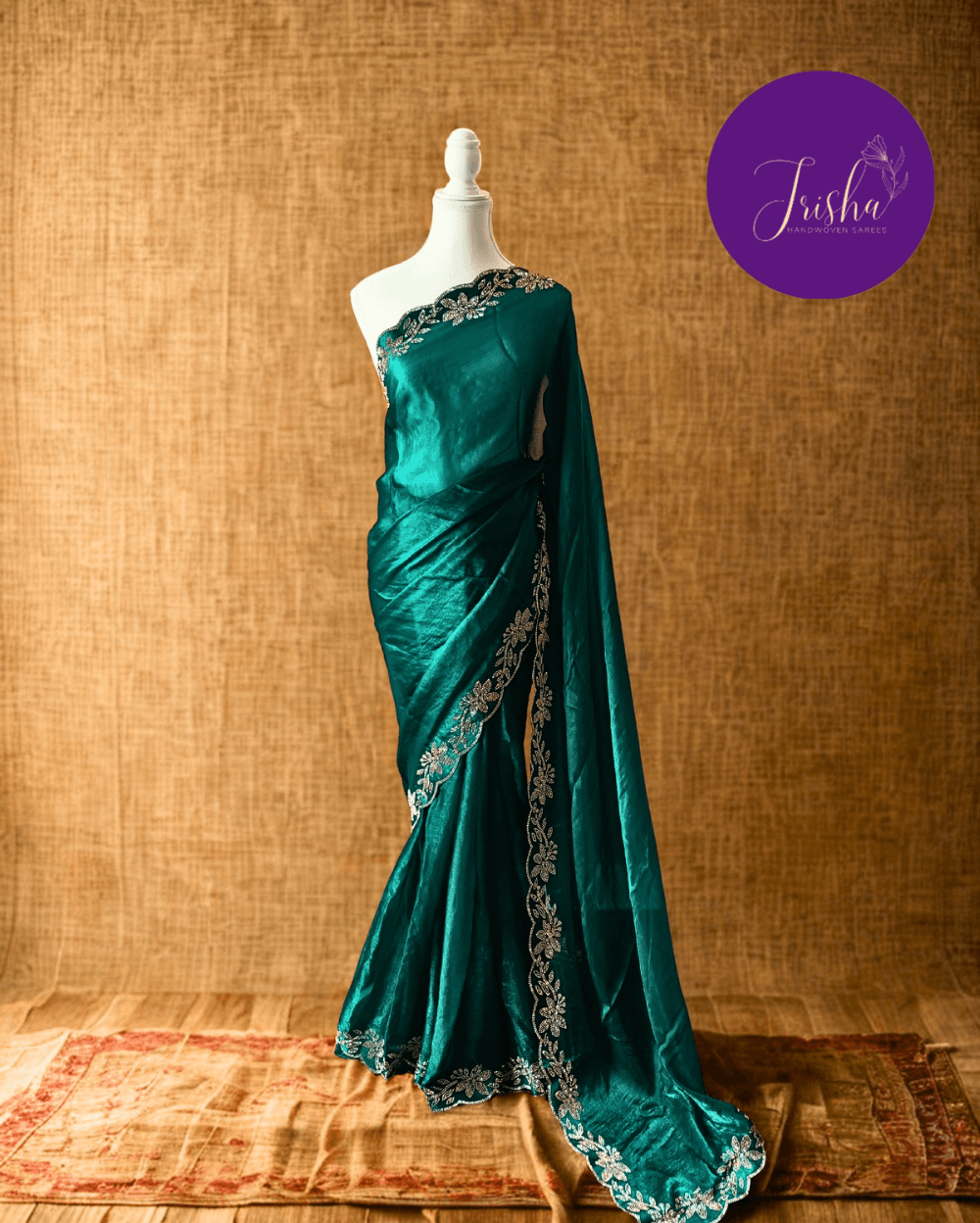 Forest Green fendy silk saree with Jharkhan Diamond Stone crystal work in Border throughout the saree and Pallu .The Pallu is beautifully done in a C shape work pattern. The shade has a light dual tone effect. Blouse has back design in Swarovski crystal work and sleeves potion has diamond stone work done.