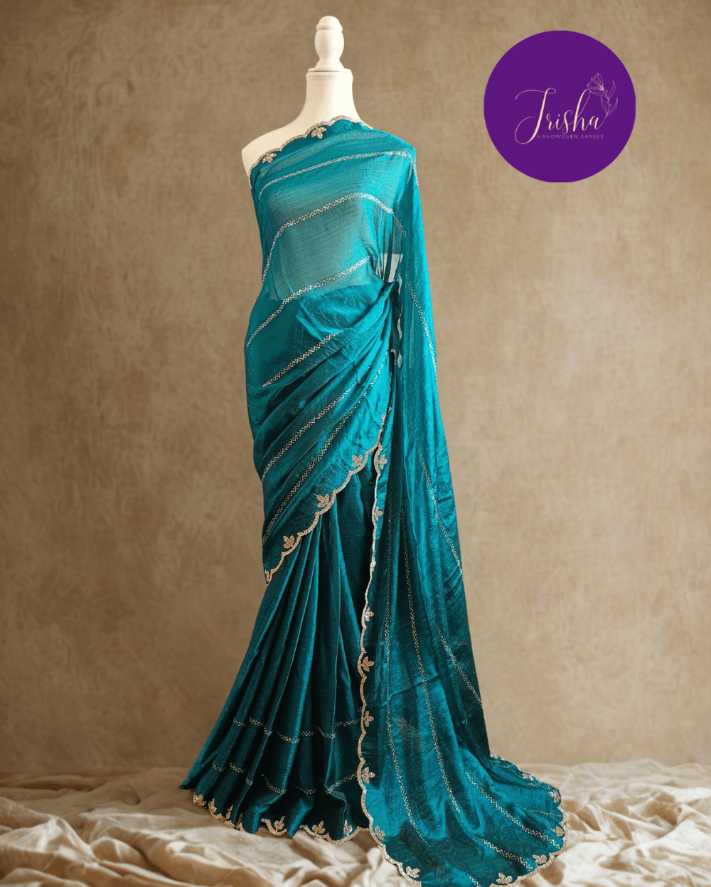 Peacock Blue fendy silk saree with Swarovski crystal work all over the shoulder and pallu portion in stripes pattern. Border throughout the saree and Pallu has diamond stone work .The saree in the skirt portion has 2 lines of striped Swarovski crystal work. The Pallu is beautifully done in a C shape work pattern. The shade has a light dual tone effect. Blouse piece has back design in Swarovski crystal work and sleeves potion has diamond stone work done.