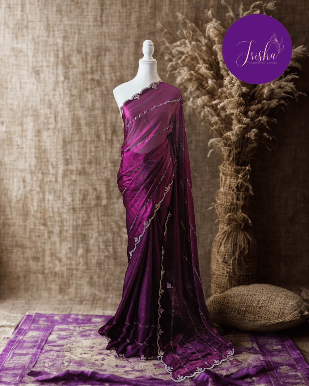 Purple fendy silk saree with Swarovski crystal work all over the shoulder and pallu portion in stripes pattern. Border throughout the saree and Pallu has diamond stone work .The saree in the skirt portion has 2 lines of striped Swarovski crystal work. The Pallu is beautifully done in a C shape work pattern. The shade has a light dual tone effect. Blouse piece has back design in Swarovski crystal work and sleeves potion has diamond stone work done.