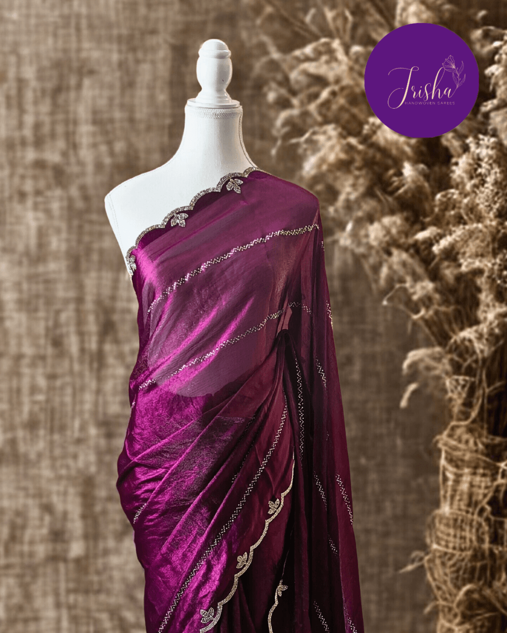 Purple fendy silk saree with Swarovski crystal work all over the shoulder and pallu portion in stripes pattern. Border throughout the saree and Pallu has diamond stone work .The saree in the skirt portion has 2 lines of striped Swarovski crystal work. The Pallu is beautifully done in a C shape work pattern. The shade has a light dual tone effect. Blouse piece has back design in Swarovski crystal work and sleeves potion has diamond stone work done.