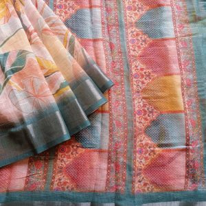 Teal Blue shade Semi Linen saree with silver tissue zari border, this saree comes with digital prints all over with a subtle silver tissue zari border. The pallu is simple with prints.