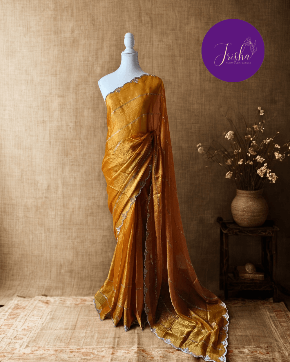 Golden Yellow fendy silk saree with Swarovski crystal work all over the shoulder and pallu portion in stripes pattern. Border throughout the saree and Pallu has diamond stone work .The saree in the skirt portion has 2 lines of striped Swarovski crystal work. The Pallu is beautifully done in a C shape work pattern. The shade has a light dual tone effect. Blouse piece has back design in Swarovski crystal work and sleeves potion has diamond stone work done.