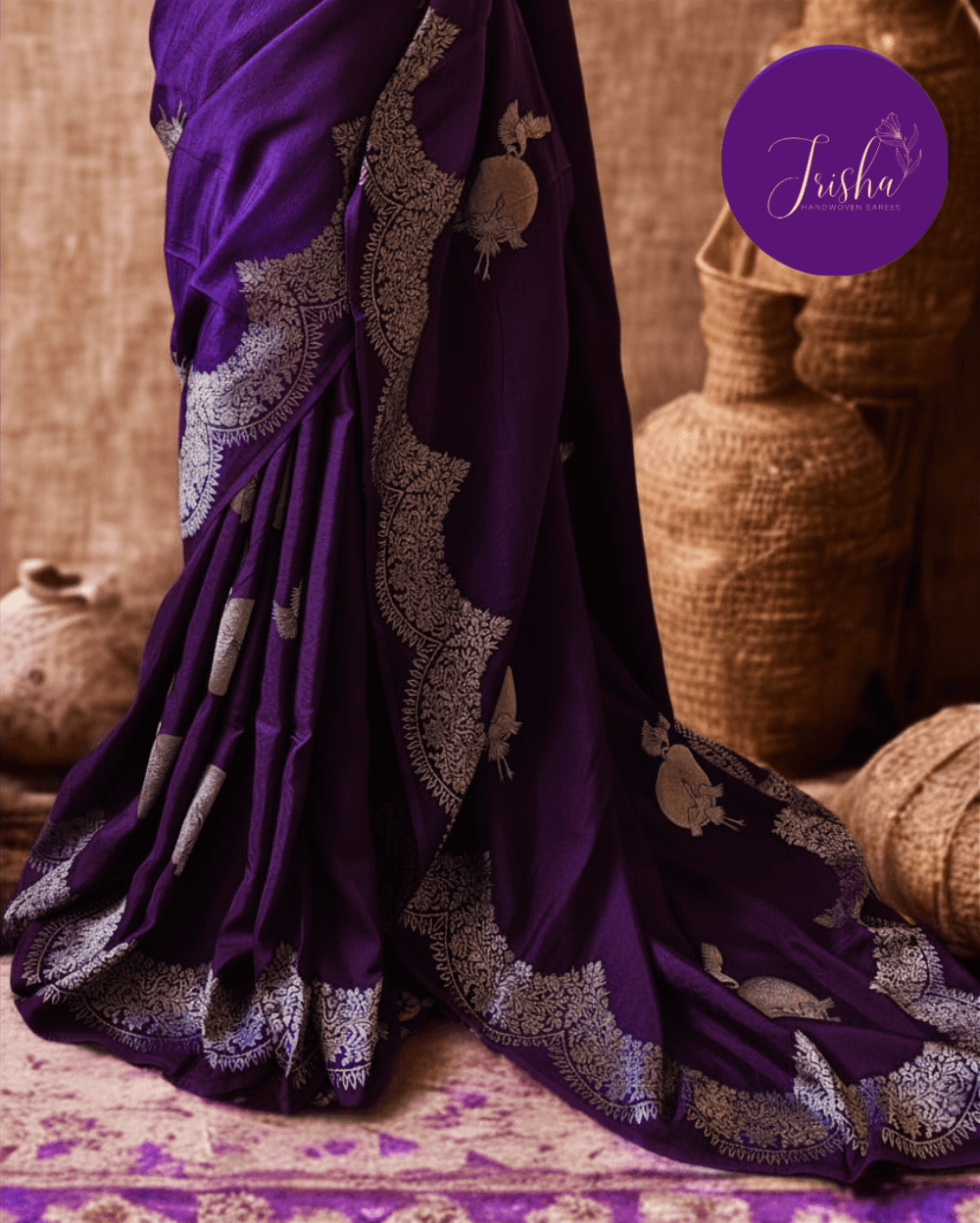 Banarasi Satin Crepe Silk in Royal Violet shade with bird motifs weaves all over the body. Very unique motifs with scallop Design woven in border.It includes plain blouse piece with border in bold and contrast Yellow shade that pairs beautifully the saree and lifts the overall look.