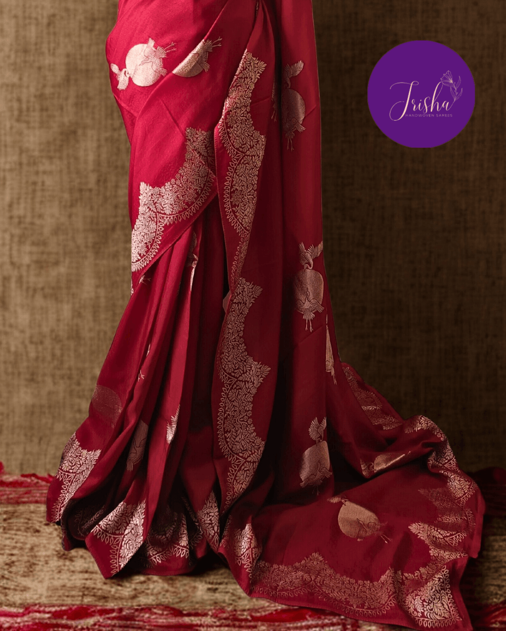 Banarasi Satin Crepe Silk in Deep Red shade with bird motifs weaves all over the body. Very unique motifs with scallop Design woven in border.It includes plain blouse piece with border in bold and contrast Dark Green shade that pairs beautifully the saree and lifts the overall look.