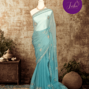Light Blue Tone with self shade thread embroidery and diamond stone work Chiffon saree. Border throughout the saree and Pallu has rich embroidery and diamond work .The Pallu is beautifully done in a C shape work pattern. The shade has a very pleasant look and and the light embellishments give a complete twist to the subtle look of the saree. Blouse Piece comes with beautiful back design with embroidery and stone work done