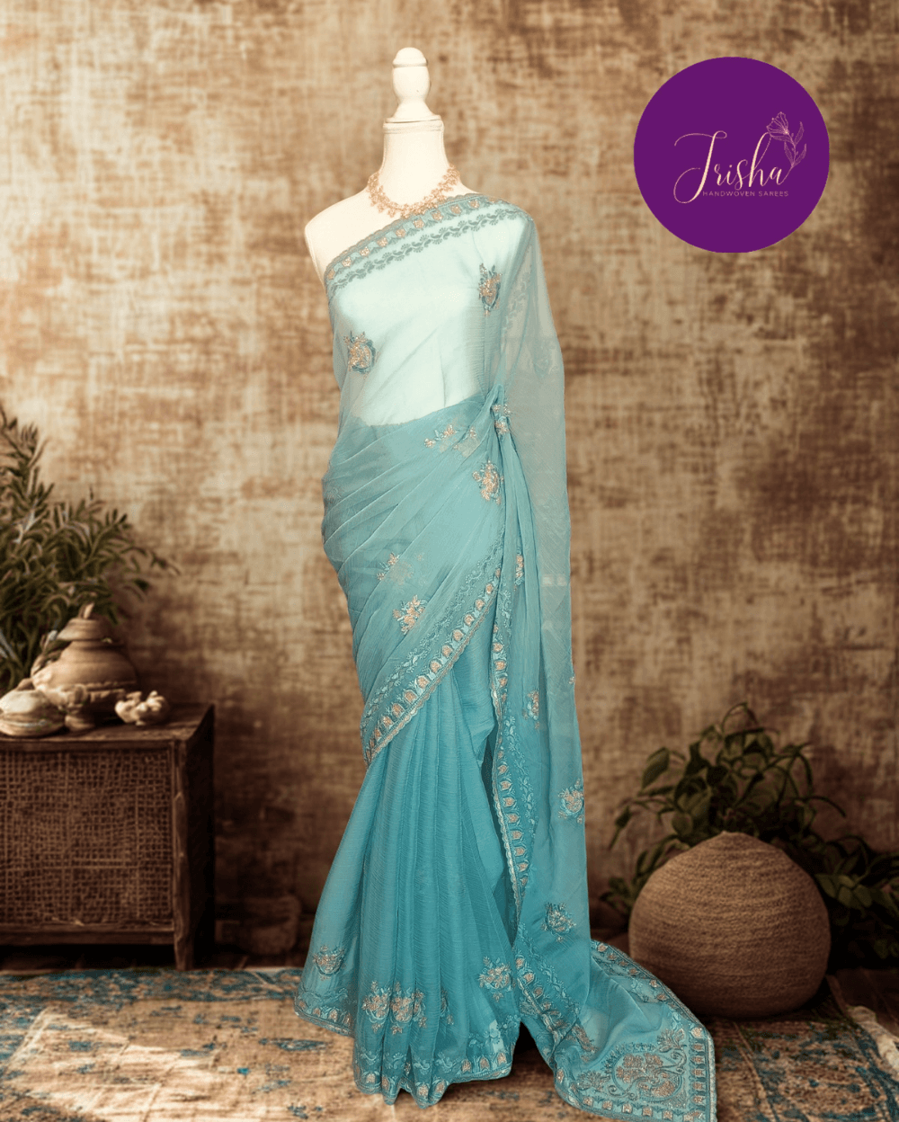 Light Blue Tone with self shade thread embroidery and diamond stone work Chiffon saree. Border throughout the saree and Pallu has rich embroidery and diamond work .The Pallu is beautifully done in a C shape work pattern. The shade has a very pleasant look and and the light embellishments give a complete twist to the subtle look of the saree. Blouse Piece comes with beautiful back design with embroidery and stone work done