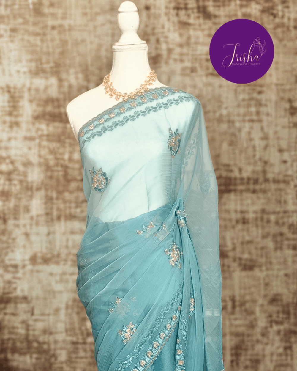 Light Blue Tone with self shade thread embroidery and diamond stone work Chiffon saree. Border throughout the saree and Pallu has rich embroidery and diamond work .The Pallu is beautifully done in a C shape work pattern. The shade has a very pleasant look and and the light embellishments give a complete twist to the subtle look of the saree. Blouse Piece comes with beautiful back design with embroidery and stone work done