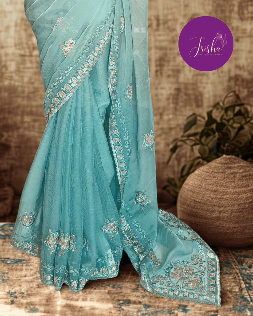 Light Blue Tone with self shade thread embroidery and diamond stone work Chiffon saree. Border throughout the saree and Pallu has rich embroidery and diamond work .The Pallu is beautifully done in a C shape work pattern. The shade has a very pleasant look and and the light embellishments give a complete twist to the subtle look of the saree. Blouse Piece comes with beautiful back design with embroidery and stone work done