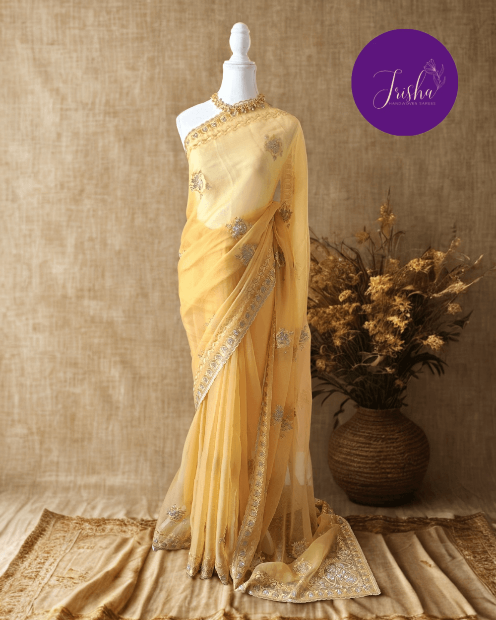 Light Butter Yellow Tone with self shade thread embroidery and diamond stone work Chiffon saree. Border throughout the saree and Pallu has rich embroidery and diamond work .The Pallu is beautifully done in a C shape work pattern. The shade has a very pleasant look and and the light embellishments give a complete twist to the subtle look of the saree. Blouse Piece comes with beautiful back design with embroidery and stone work done