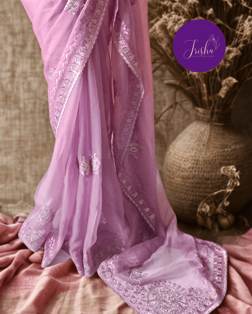Lilac Tone with self shade thread embroidery and diamond stone work Chiffon saree. Border throughout the saree and Pallu has rich embroidery and diamond work .The Pallu is beautifully done in a C shape work pattern. The shade has a very pleasant look and and the light embellishments give a complete twist to the subtle look of the saree. Blouse Piece comes with beautiful back design with embroidery and stone work done.