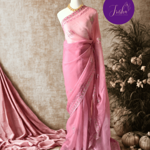 Pink Tone with self shade thread embroidery and diamond stone work Chiffon saree. Border throughout the saree and Pallu has rich embroidery and diamond work .The Pallu is beautifully done in a C shape work pattern. The shade has a very pleasant look and and the light embellishments give a complete twist to the subtle look of the saree. Blouse Piece comes with beautiful back design with embroidery and stone work done.