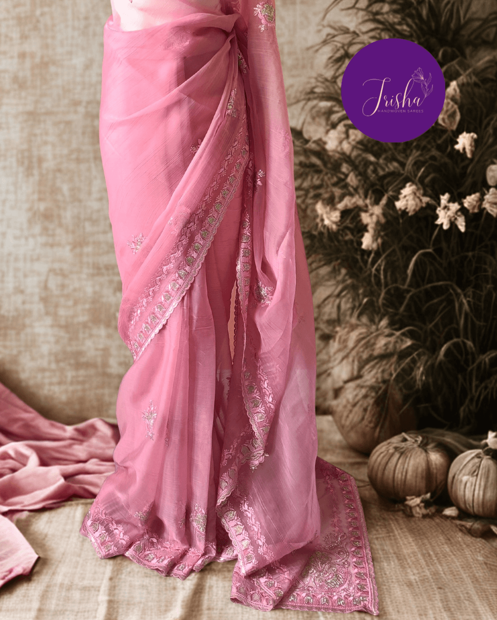 Pink Tone with self shade thread embroidery and diamond stone work Chiffon saree. Border throughout the saree and Pallu has rich embroidery and diamond work .The Pallu is beautifully done in a C shape work pattern. The shade has a very pleasant look and and the light embellishments give a complete twist to the subtle look of the saree. Blouse Piece comes with beautiful back design with embroidery and stone work done.