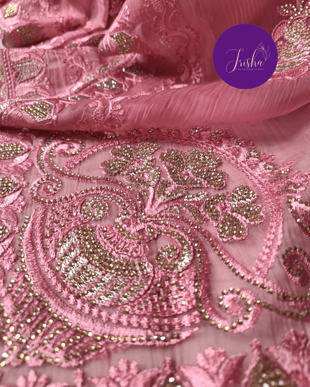 Pink Tone with self shade thread embroidery and diamond stone work Chiffon saree. Border throughout the saree and Pallu has rich embroidery and diamond work .The Pallu is beautifully done in a C shape work pattern. The shade has a very pleasant look and and the light embellishments give a complete twist to the subtle look of the saree. Blouse Piece comes with beautiful back design with embroidery and stone work done.