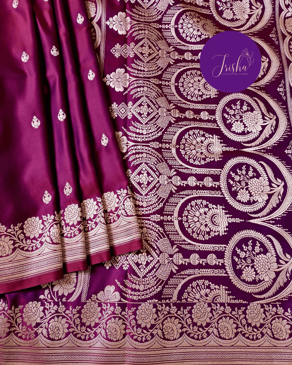 Banarasi Mashru Katan Silk saree in Pink Purple dual tone shade with small buttis all over the saree. The Rose Gold zari makes the finish very royal and elegant. Saree has a very beautiful traditional border and a very rich pallu that makes the usage of this saree suit any occasion or formal wear. The Pallu is attractively designed and woven with intricate Banarasi floral motifs.