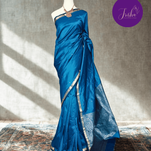 Kanchipuram / Kanjivaram Silk Sari with Small Zari Border and rich pallu in Blue shade with Self Border and self Pallu,Gold Small Zari Border on both sides with traditional Kanchipuram Peacock motifs.Traditional motifs in the border with leaf motifs all over pallu. Body of the saree has small buttas.