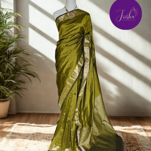 Kanchipuram / Kanjivaram Silk Saree with Gold Zari Border on both sides with traditional Kanchipuram Peacock motifs. Light Green saree with Self Border and Pallu. Traditional Peacock motifs in the border with floral motifs all over pallu. Body of the saree has small floral buttas in two different geometric patterns.