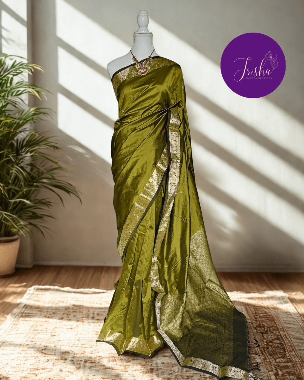 Kanchipuram / Kanjivaram Silk Saree with Gold Zari Border on both sides with traditional Kanchipuram Peacock motifs. Light Green saree with Self Border and Pallu. Traditional Peacock motifs in the border with floral motifs all over pallu. Body of the saree has small floral buttas in two different geometric patterns.