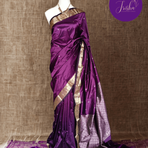Kanchipuram / Kanjivaram Silk Saree with Gold Zari Border on both sides with traditional Kanchipuram Peacock motifs. Royal Purple saree with Self Border and Pallu. Traditional Peacock motifs in the border with floral motifs all over pallu. Body of the saree has small floral buttas in two different geometric patterns.